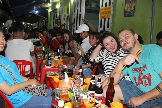 Food Tour by motorbike with local students - Stop two: grilled beef, betel leaf, and Vietnamese beer