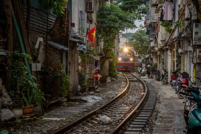 Hanoi City Motorbike Tour with Banana Island and Local Food - Long Bien Bridge brings transport, war, and city life together