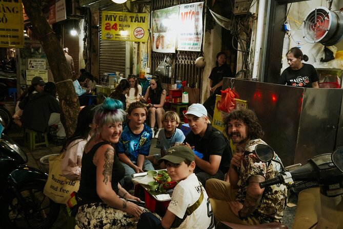 Hanoi Motorbike Street Food Tour With Sightseeing - Food, guides, and the human side of the tour
