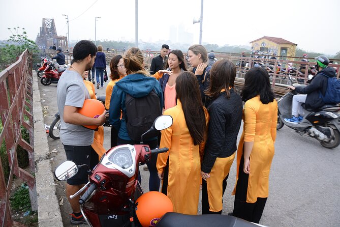 Hanoi Motorbike Tour Led By Women - City And Countryside Full Day - Co Loa Citadel, wet market, fruit, and Lotus Lake