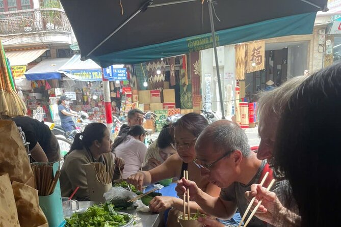 Hanoi Street Food Tour by Motorbike or Walking with Local Guide - Phung Hung Mural Street and the old railway arches
