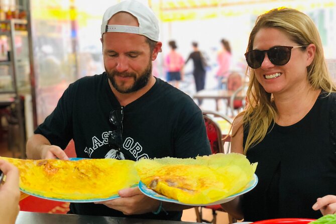 Ho Chi Minh City Street Food Tour & Sightseeing By Motorbike - Cambodian Market and the city’s snack culture