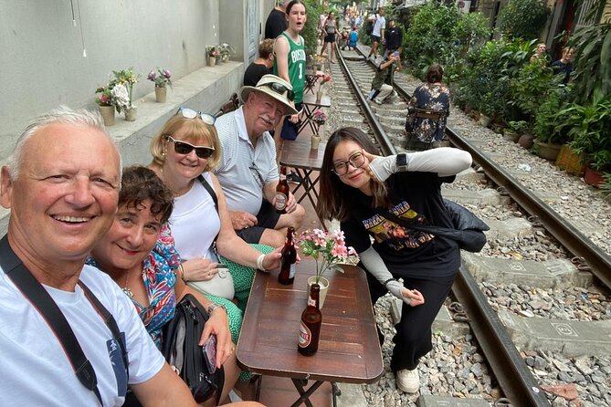 Private Half-Day Hanoi Food Tour by Motorbike - Train Street: photographs, cafés, and a changing stop