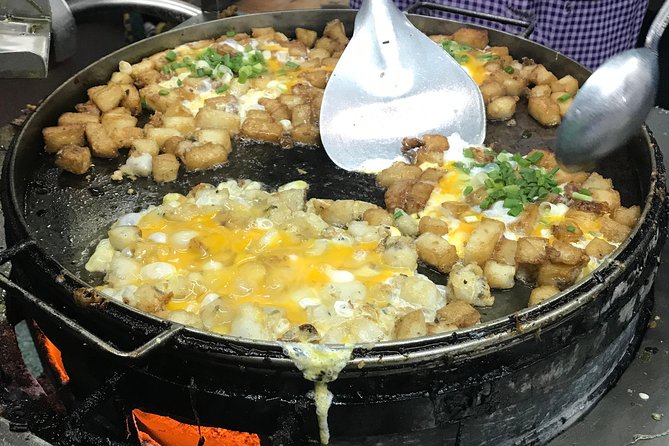 Private Ho Chi Minh Street Food Tour by Motorbike with Ao Dai Female Rider - Noodle soup in a local setting
