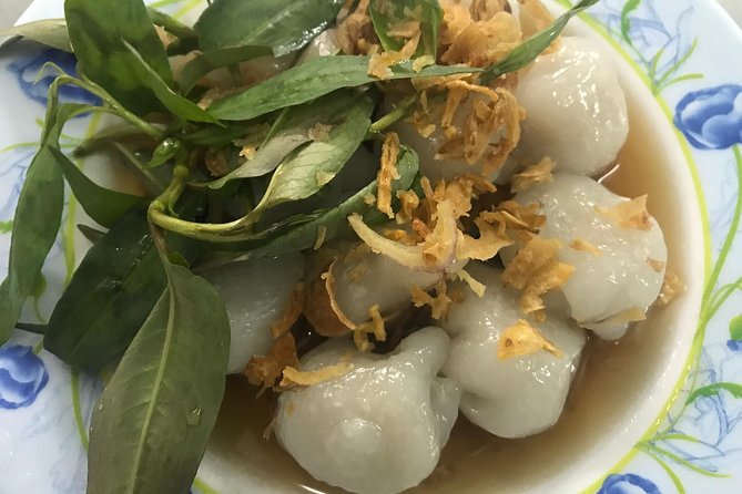 Private Ho Chi Minh Street Food Tour by Motorbike with Ao Dai Female Rider - Seafood, snails, beer, and a few brave choices
