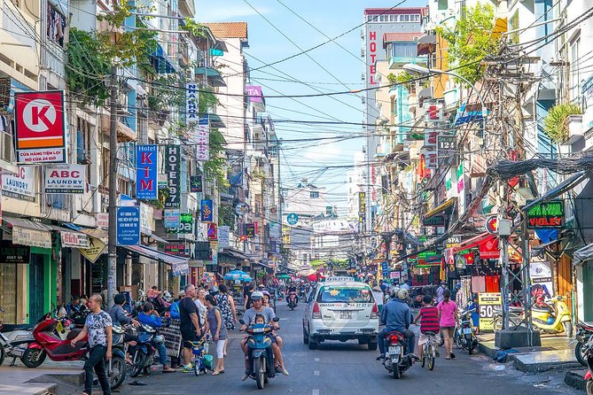 Small group Saigon Inside Out by Motorbike for 3 Hours - Food, snacks, and a local drink